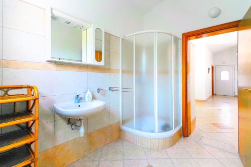 a bathroom with a shower and a sink at Apartment Vir Croatia in Vir