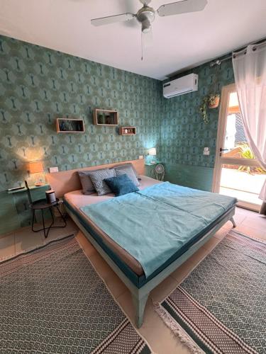 Ένα ή περισσότερα κρεβάτια σε δωμάτιο στο Casa Paradise