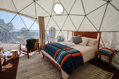 a bedroom with a bed in a tent at Cozy Dome Hideaway with Sweeping Sunrise View in Fallbrook