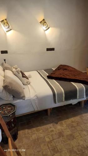 a bedroom with a bed in a room at Dar Essalama Dades in Akhendachou nʼAït Ouffi