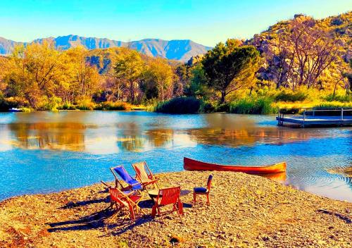 a group of chairs sitting on the shore of a lake at Rancho Grande in Ojai