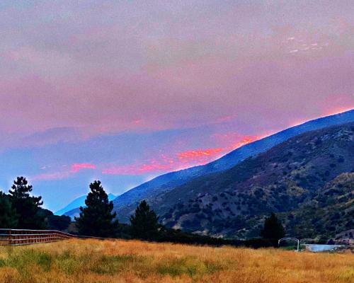 a view of a mountain range with a sunset at Rancho Grande in Ojai