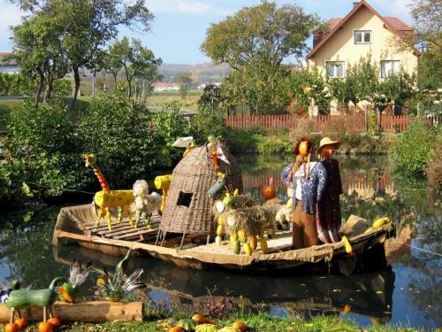 a group of figurines on a raft in the water at FERIENHAUS Weinviertel in Pernersdorf