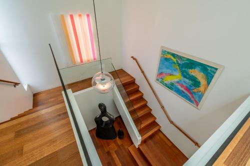 an overhead view of a stairway with a painting at Seascape by Paradise Retreats in Carpinteria