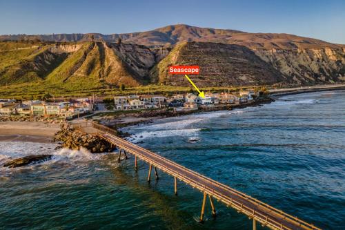 an aerial view of a bridge over the water and a beach at Seascape by Paradise Retreats in Carpinteria