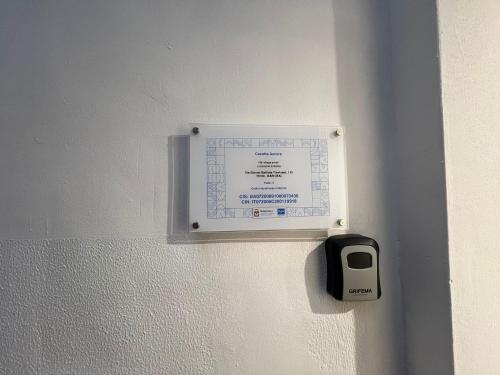a sign on a wall with a first team tag at Casetta Aurora in Bari