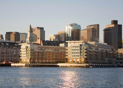 a view of a city from the water with buildings at Battery Wharf Hotel, Boston Waterfront in Boston