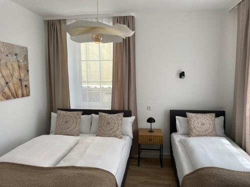Ένα ή περισσότερα κρεβάτια σε δωμάτιο στο Fewo CityNest Kempten