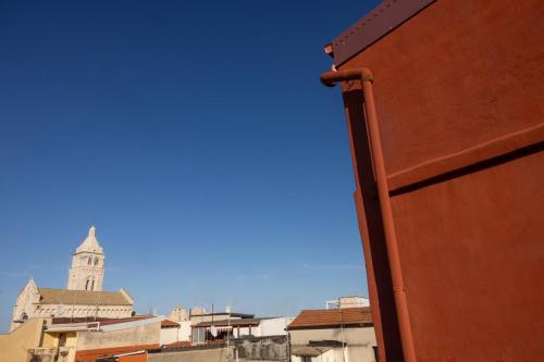 a view of a building with a clock tower at My Home in Barletta