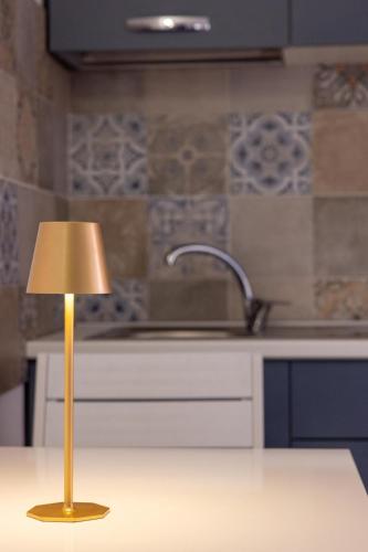 a lamp sitting on a kitchen counter next to a sink at My Home in Barletta