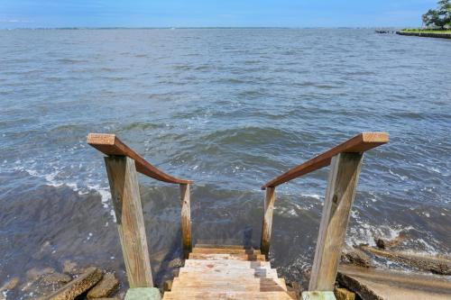 a wooden stairway leading into the water at 5550 - Lighthouse Pointe in Kill Devil Hills