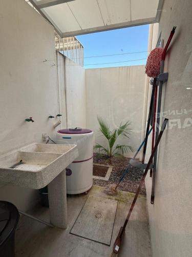 a bathroom with a sink and a toilet at Casa del Lago in Veracruz