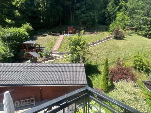 a view of a garden from the balcony of a house at Penzión Dúhový Pstruh in Bystrá