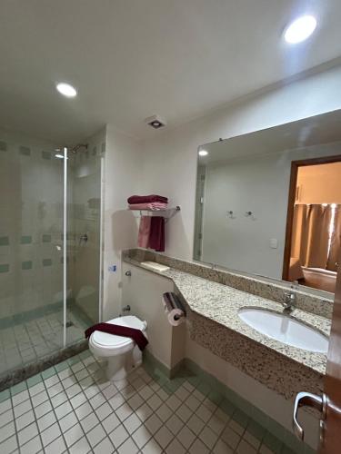a bathroom with a toilet and a sink and a shower at Flat Ibirapuera V Mariana Borges Lagoa com garagem 512 in Sao Paulo