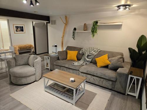 a living room with two couches and a coffee table at The Hilltop in Whitehorse