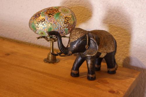 a small figurine of an elephant next to a lamp at Mints Hotel Ağva in Agva