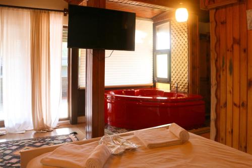a bathroom with a red tub in a room at Mints Hotel Ağva in Agva