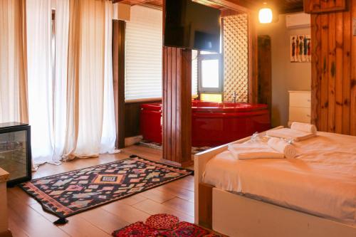 a bedroom with a bed and a television in it at Mints Hotel Ağva in Agva