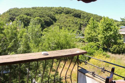 a cup of coffee sitting on top of a balcony at Mints Hotel Ağva in Agva
