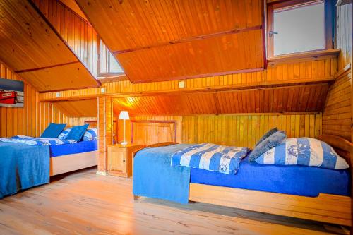 Postel nebo postele na pokoji v ubytování Słoneczna Przystań