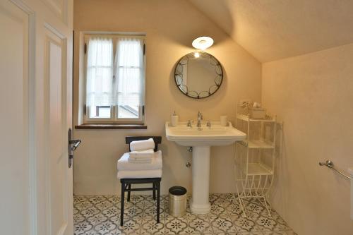 a bathroom with a sink and a mirror at Pri Mimiki in Kamnica