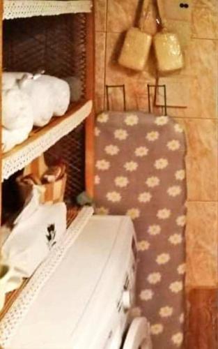 a room with a shelf with a suitcase on it at Beautiful stone house in Samos in Samos
