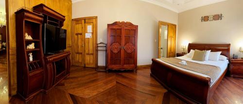 Ein Bett oder Betten in einem Zimmer der Unterkunft Hotel Boutique Casa Ruth en Cuenca