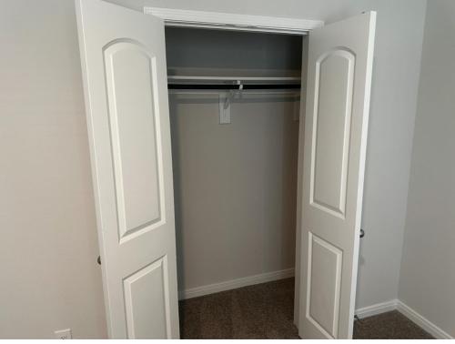 a closet with a white door and a closet at Cozy, Comfy and Relaxing! 