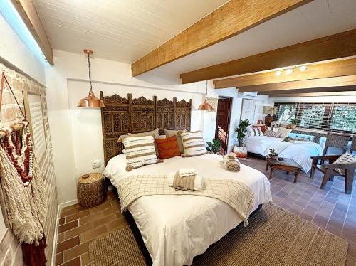 a bedroom with a large bed in a room at The Bryanston Boutique in Johannesburg