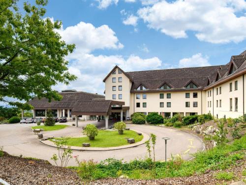 an exterior view of a building at Mövenpick Hotel Egerkingen in Egerkingen