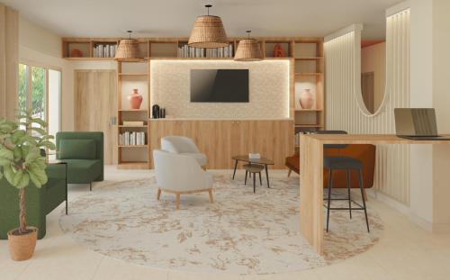 un salon avec une télévision, une table et des chaises dans l'établissement Best Western Terra Alta Perpignan Airport, à Perpignan