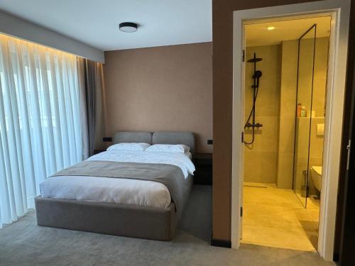 Ένα ή περισσότερα κρεβάτια σε δωμάτιο στο Five Apartments