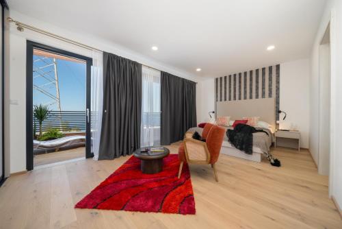 a bedroom with a bed and a large window at Villa Marko Forever in Makarska