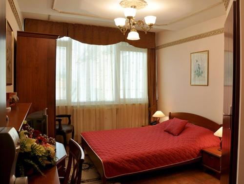 Postel nebo postele na pokoji v ubytování Hotel Tivoli