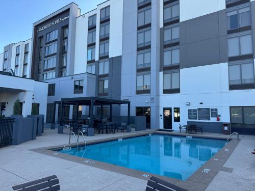 a swimming pool in front of a building at Homewood Suites by Hilton Oklahoma City Airport in Oklahoma City