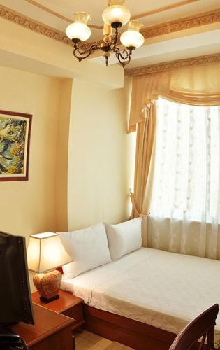 Postel nebo postele na pokoji v ubytování Hotel Tivoli