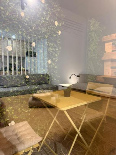 a living room with a table and a couch at Douro Village B in Gião