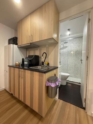 a kitchen with a sink and a toilet in a bathroom at Douro Village B in Gião