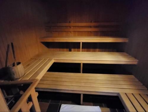 a empty room with wooden shelves in a room at Genziana Apartment in Marilleva