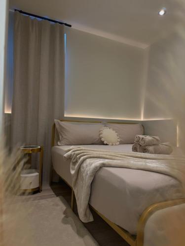 a bedroom with a white bed with a window at 3 KING beds Free Parking Modern Luxe Escape in Pittsburgh
