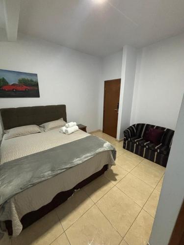 Cama o camas de una habitación en Suíte confortável e espaçosa