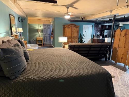 a bedroom with a large bed in the middle of a room at Cozy Retreat in the Heart of it all! in Brooksville