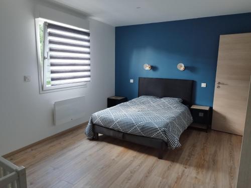 Cama o camas de una habitación en Gîtel'harmonie2