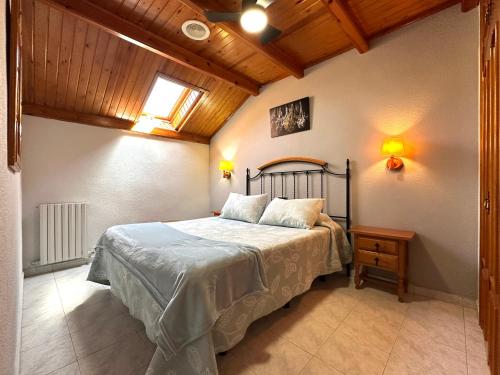 a bedroom with a bed in a room at Apartamentos Lausan in Gavín