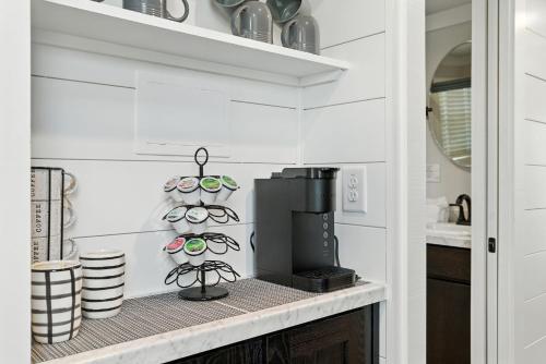 a kitchen counter with a coffee maker on a shelf at Pigeon Forge Landing RV Resort in Pigeon Forge