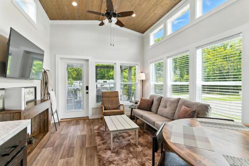 a living room with a couch and a table at Pigeon Forge Landing RV Resort in Pigeon Forge