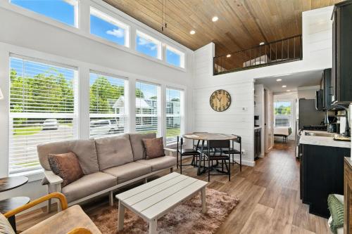 a living room with a couch and a table at Pigeon Forge Landing RV Resort in Pigeon Forge