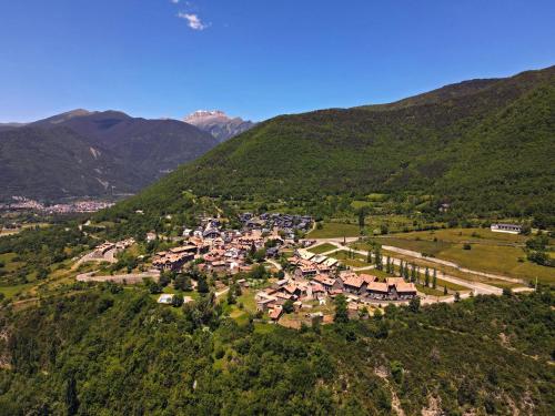 an aerial view of a village in the mountains at Apartamentos Lausan in Gavín