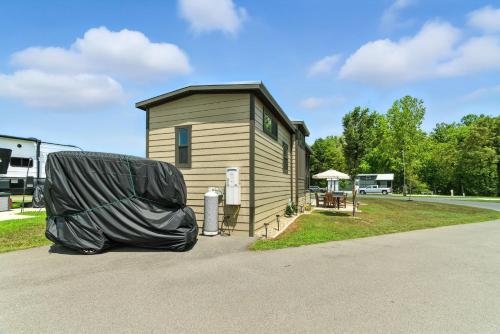 a small building with a cover on the side of it at Pigeon Forge Landing RV Resort in Pigeon Forge