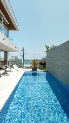 a swimming pool in the backyard of a house at Château Marine by SUNGA in KAMAKURA in Kamakura